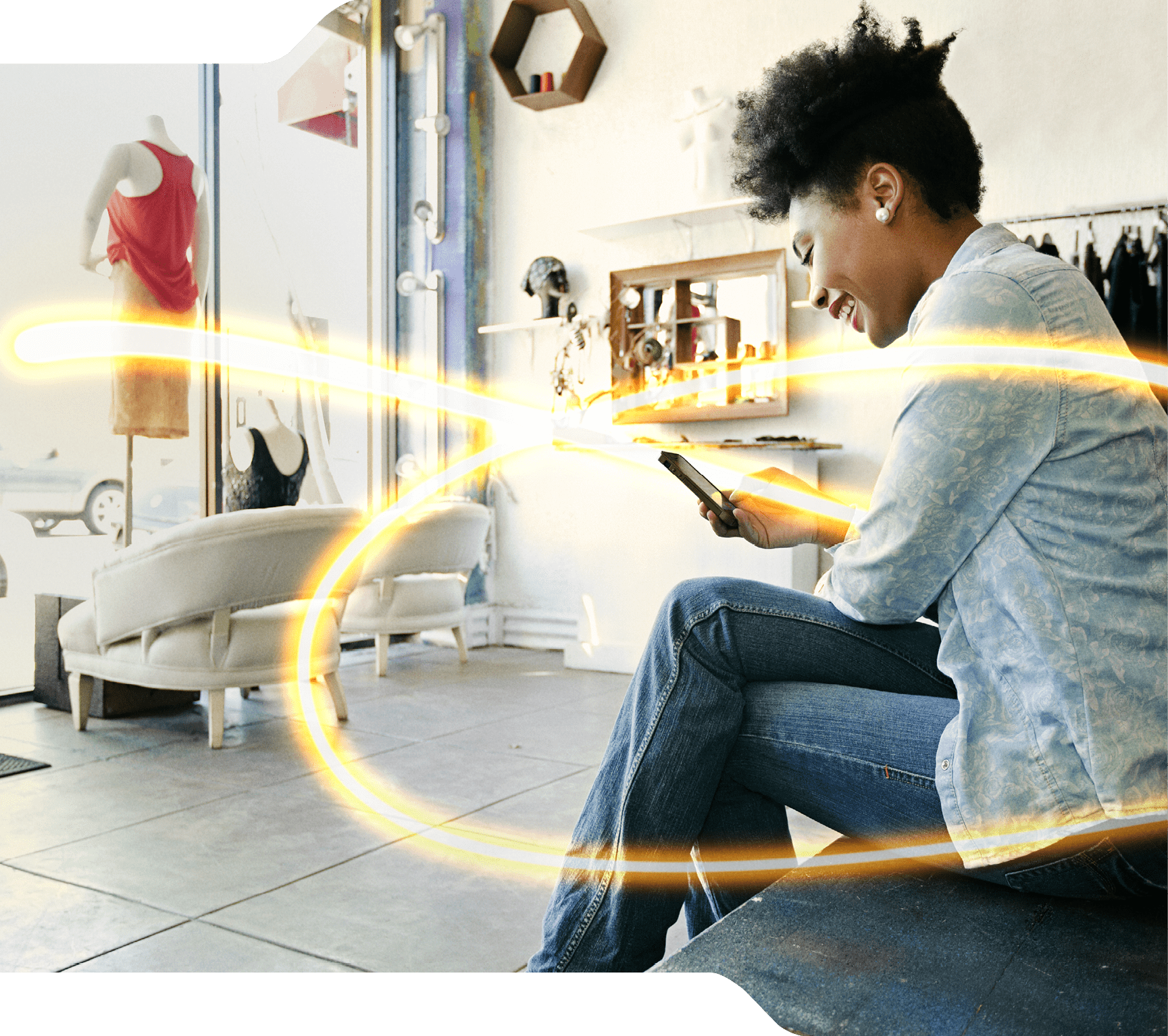 Mixed race woman using cell phone in store